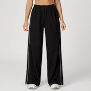 Daisy Harrison | Pantalon de survêtement noir à jambes larges avec bandes latérales