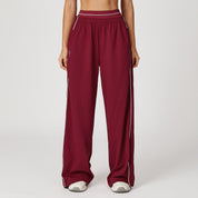 Daisy Harrison | Pantalon de survêtement noir à jambes larges avec bandes latérales