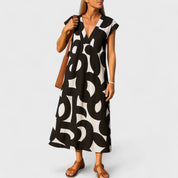 Sophia Whitmore | Robe longue à col en V et imprimé abstrait